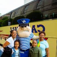 Family posing with Louie the Laker